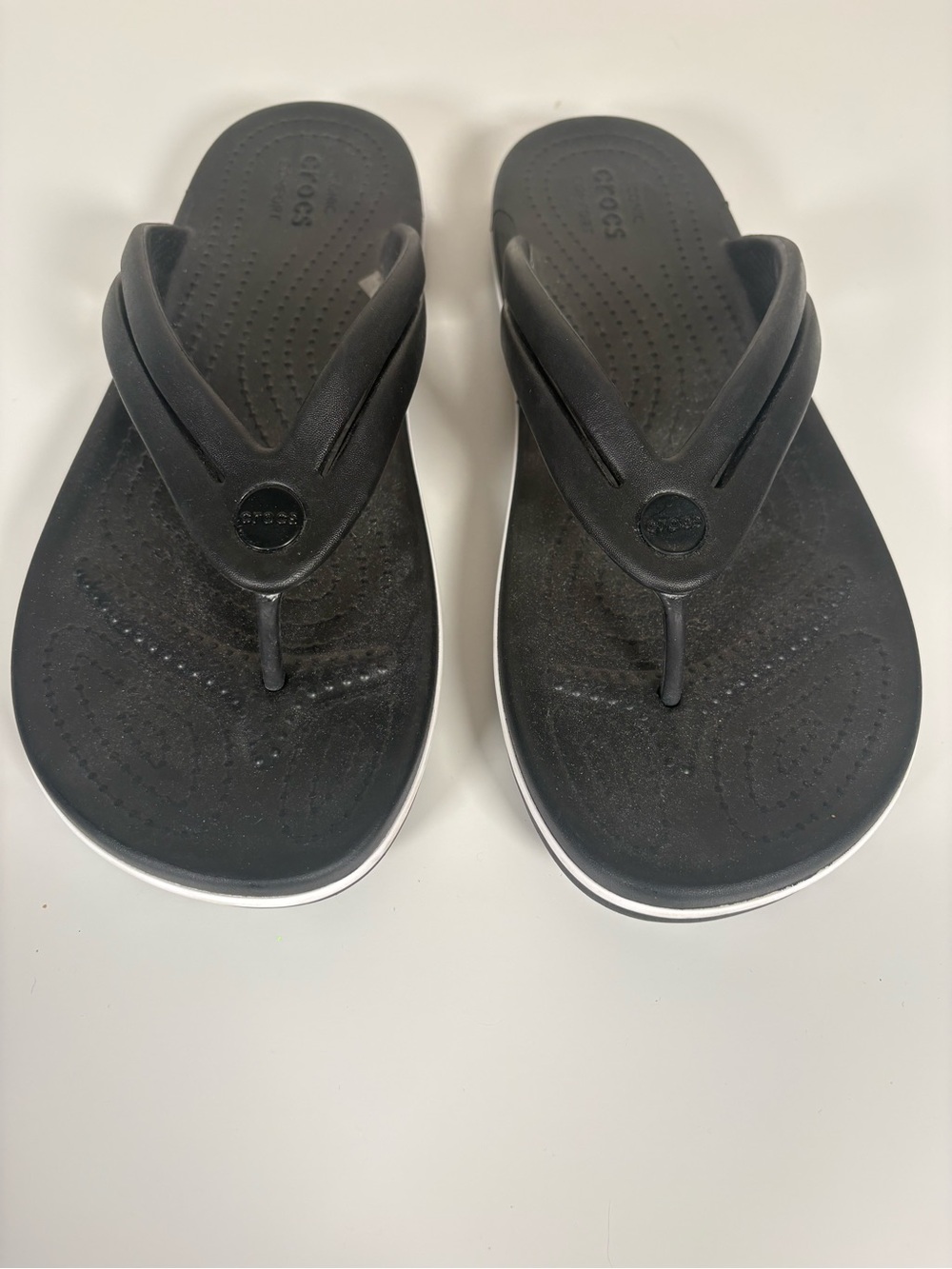 CROCS Black Flip Sandals with White Trim